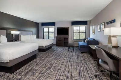 a hotel room with two beds and a desk at Hampton Inn & Suites Agoura Hills in Agoura Hills