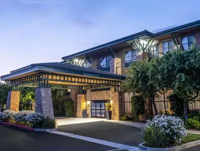 a building with a parking lot in front of it at Hampton Inn & Suites Agoura Hills in Agoura Hills