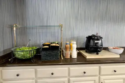 a counter with some food and a mixer on it at Homewood Suites Bakersfield in Bakersfield