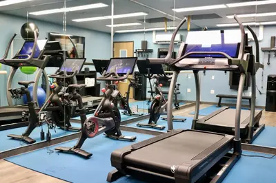 a gym with several treadmills and exercise bikes at Shade Hotel Redondo Beach in Redondo Beach