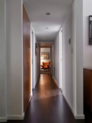 an empty hallway with a chair in a room at Chateau Marmont in Los Angeles