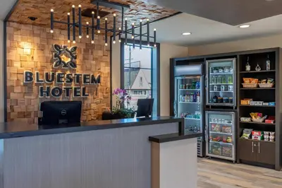 a hotel lobby with a blueenstein hotel sign on the wall at Bluestem Hotel Torrance Los Angeles, an Ascend Collection Hotel in Torrance