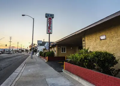 a sign for a hotel on the side of a street at Casa Bell Motel, Los Angeles - LAX Airport in Inglewood