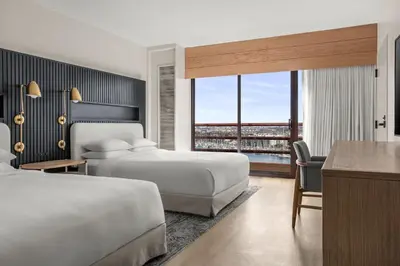 a hotel room with two beds and a desk at Marina del Rey Marriott in Los Angeles