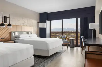 a hotel room with two beds and a desk at Marina del Rey Marriott in Los Angeles