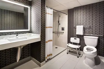 a bathroom with a sink and a toilet and a shower at Los Angeles Airport Marriott in Los Angeles
