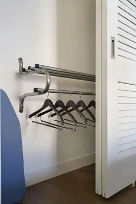 a closet with a rack of hangers at Courtyard by Marriott Long Beach Downtown in Long Beach