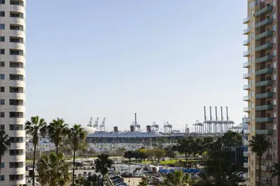 a view of a city with a factory in the background at Courtyard by Marriott Long Beach Downtown in Long Beach