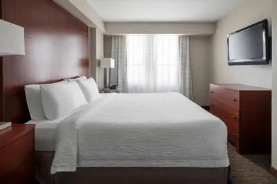 a hotel room with a bed and a television at Residence Inn Long Beach Downtown in Long Beach