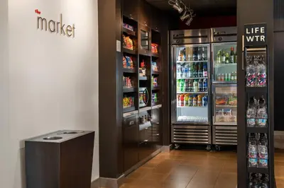 a large refrigerator in a store with drinks at Courtyard by Marriott Bakersfield in Bakersfield