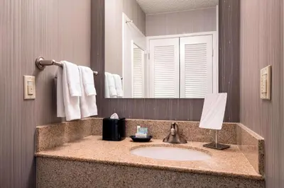a bathroom with a sink and a mirror at Sonesta Select Los Angeles Torrance South Bay in Torrance