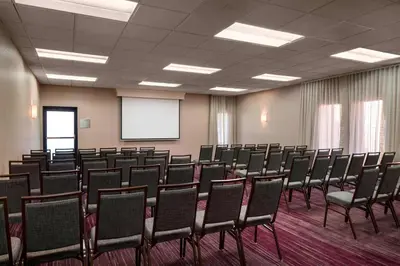 a conference room with a bunch of chairs in it at Sonesta Select Los Angeles Torrance South Bay in Torrance