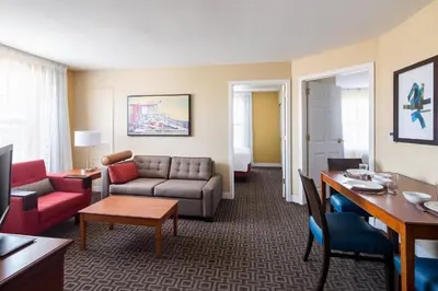 a living room with a couch and a table at TownePlace Suites Los Angeles LAX Manhattan Beach in Hawthorne