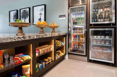 a grocery store refrigerator with two baskets of food at Residence Inn Los Angeles Torrance/Redondo Beach in Torrance