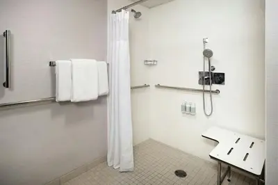 a bathroom with a shower and a sink at Courtyard Los Angeles Torrance/Palos Verdes in Torrance