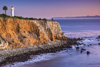 a lighthouse on a cliff next to the ocean at Courtyard Los Angeles Torrance/Palos Verdes in Torrance