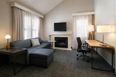 a living room with a couch and a fireplace at Residence Inn Anaheim Placentia/Fullerton in Placentia