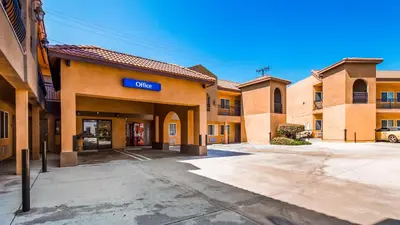 a building with a sign that reads city at Motel 6 South Gate CA in South Gate