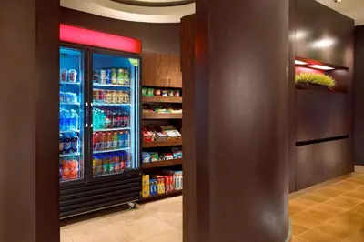 a grocery store aisle with a refrigerator filled with drinks at Courtyard by Marriott Anaheim Resort/Convention Center in Anaheim
