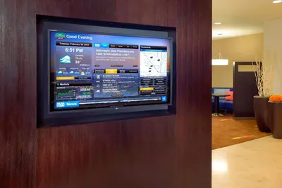 a flat screen tv on a wall in an office at Courtyard by Marriott Anaheim Resort/Convention Center in Anaheim