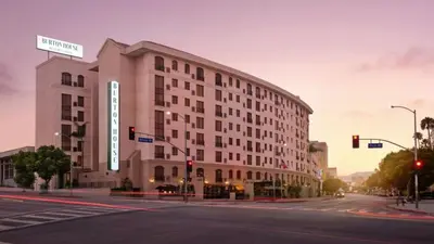a large white building on a city street at Burton House, Beverly Hills, A Tribute Portfolio Hotel in Los Angeles