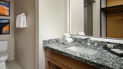 a bathroom with a sink and a mirror at Burton House, Beverly Hills, A Tribute Portfolio Hotel in Los Angeles
