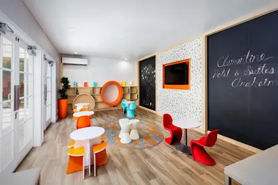 a childrens play room with tables and chairs at Clementine Hotel & Suites Anaheim in Anaheim