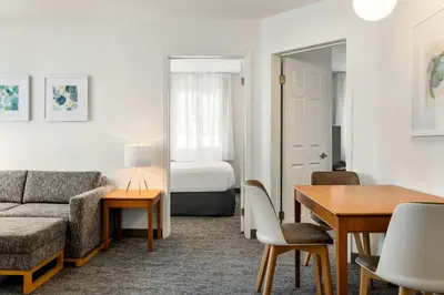 a living room with a couch and a table at TownePlace Suites by Marriott Anaheim Maingate Near Angel Stadium in Anaheim