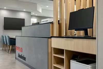 an office with a desk with a television on it at TownePlace Suites by Marriott Anaheim Maingate Near Angel Stadium in Anaheim