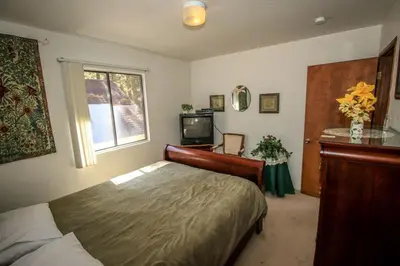 a bedroom with a bed and a television in it at Family Fun House in Big Bear Lake