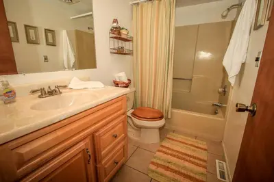 a bathroom with a sink and a toilet and a shower at Family Fun House in Big Bear Lake