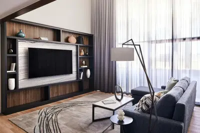 a living room with a couch and a television at Anaheim Marriott in Anaheim