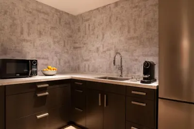 a kitchen with a sink and a microwave at JW Marriott Los Angeles L.A. LIVE in Los Angeles