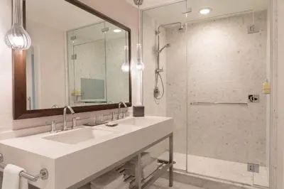 a bathroom with a sink and a shower at JW Marriott Los Angeles L.A. LIVE in Los Angeles