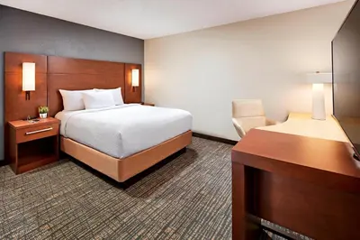 a hotel room with a bed and a desk at Residence Inn Los Angeles LAX/Manhattan Beach in Manhattan Beach