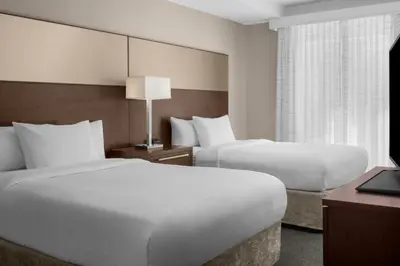a hotel room with two beds and a window at Residence Inn by Marriott Santa Clarita Valencia in Santa Clarita