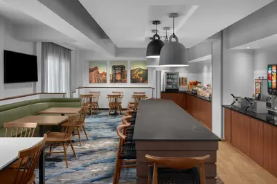 a restaurant with tables and chairs and a bar at Fairfield Inn by Marriott Santa Clarita Valencia in Santa Clarita