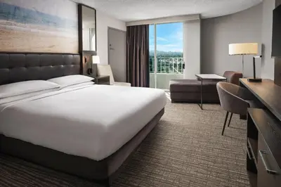 a hotel room with a large bed and a desk at Warner Center Marriott Woodland Hills in Woodland Hills