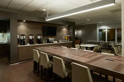 a conference room with a large wooden table and chairs at Residence Inn Los Angeles Westlake Village in Westlake Village