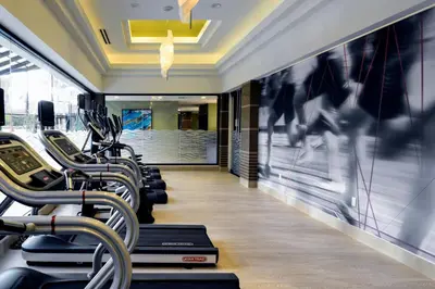 a row of treadmills in a gym with people on the treadmill at Long Beach Marriott in Long Beach