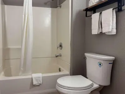 a bathroom with a toilet and a tub and a shower at Motel 6-Simi Valley, CA in Simi Valley