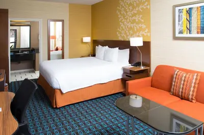 a hotel room with a bed and a chair at Fairfield Inn Anaheim Hills Orange County in Anaheim