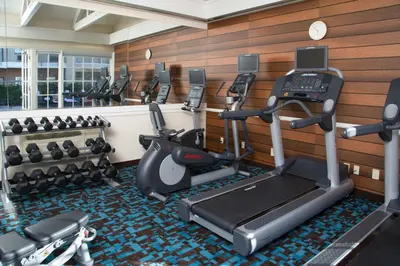 a gym with several treadmills and cardio machines at Fairfield Inn Anaheim Hills Orange County in Anaheim