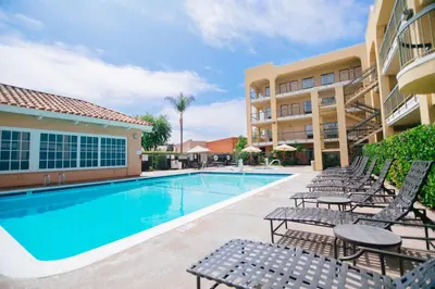 a swimming pool with chairs and a hotel at Fairfield Inn Anaheim Hills Orange County in Anaheim