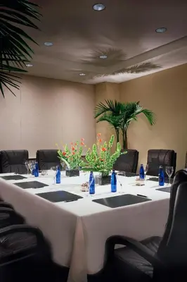 a conference room with a long table with chairs at Courtyard Los Angeles Sherman Oaks in Sherman Oaks
