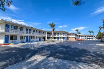 a parking lot in front of a hotel at Motel 6-Stanton, CA- Anaheim West in Stanton