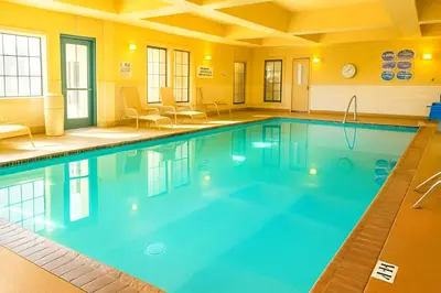a large swimming pool in a hotel room at Best Western Hesperia-Victorville Suites in Hesperia