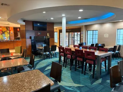a dining room with tables and chairs in a restaurant at Best Western Hesperia-Victorville Suites in Hesperia