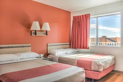 a hotel room with two beds and a window at Motel 6-Mojave, CA in Mojave
