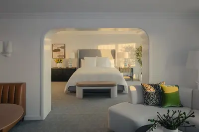 a bedroom with a large bed and a couch at Regent Santa Monica Beach in Los Angeles